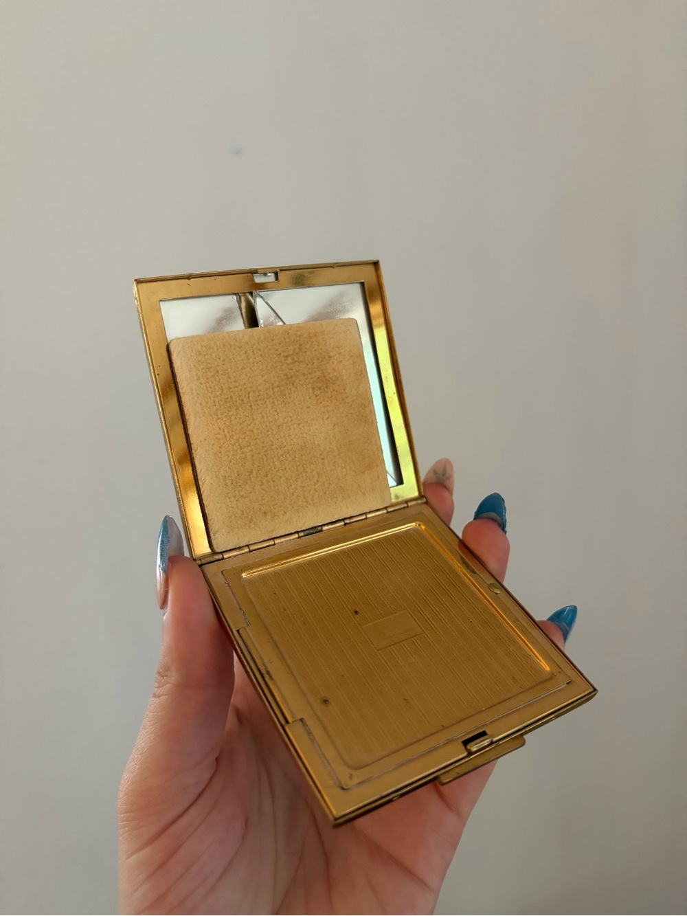 vintage Elgin American gold powder compact with an etched floral design